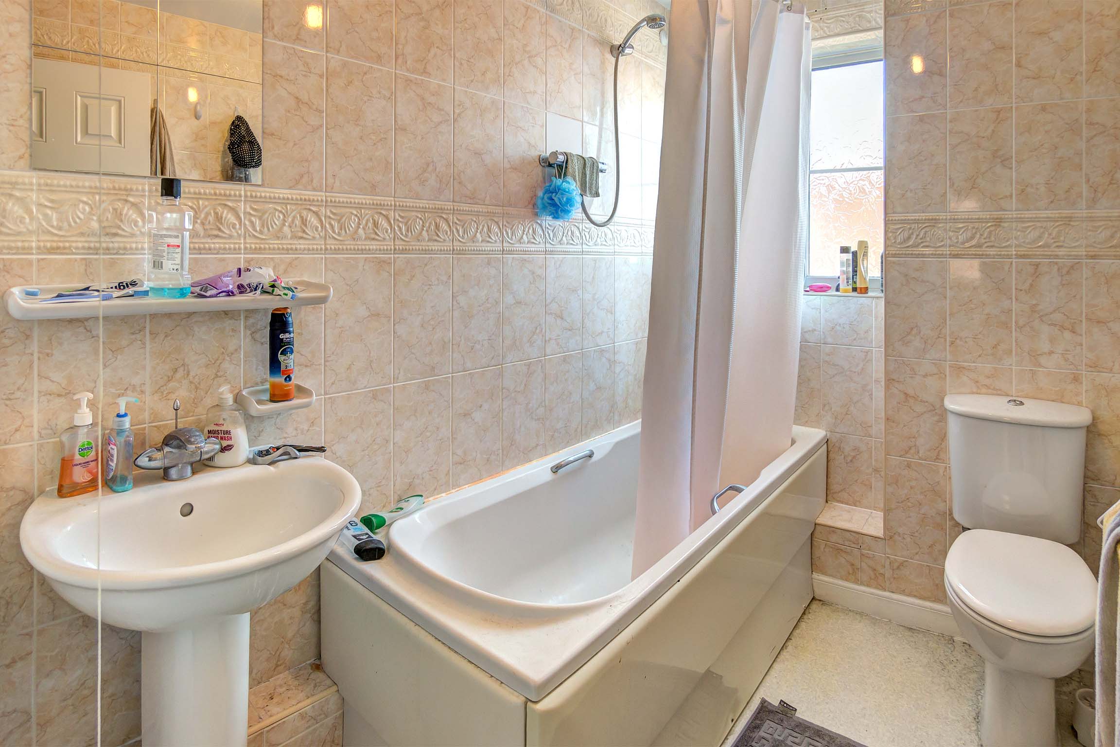 Bathroom with shower over the bath set up