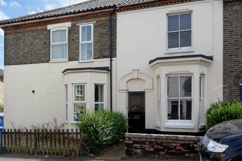 White painted terraced house with bay window