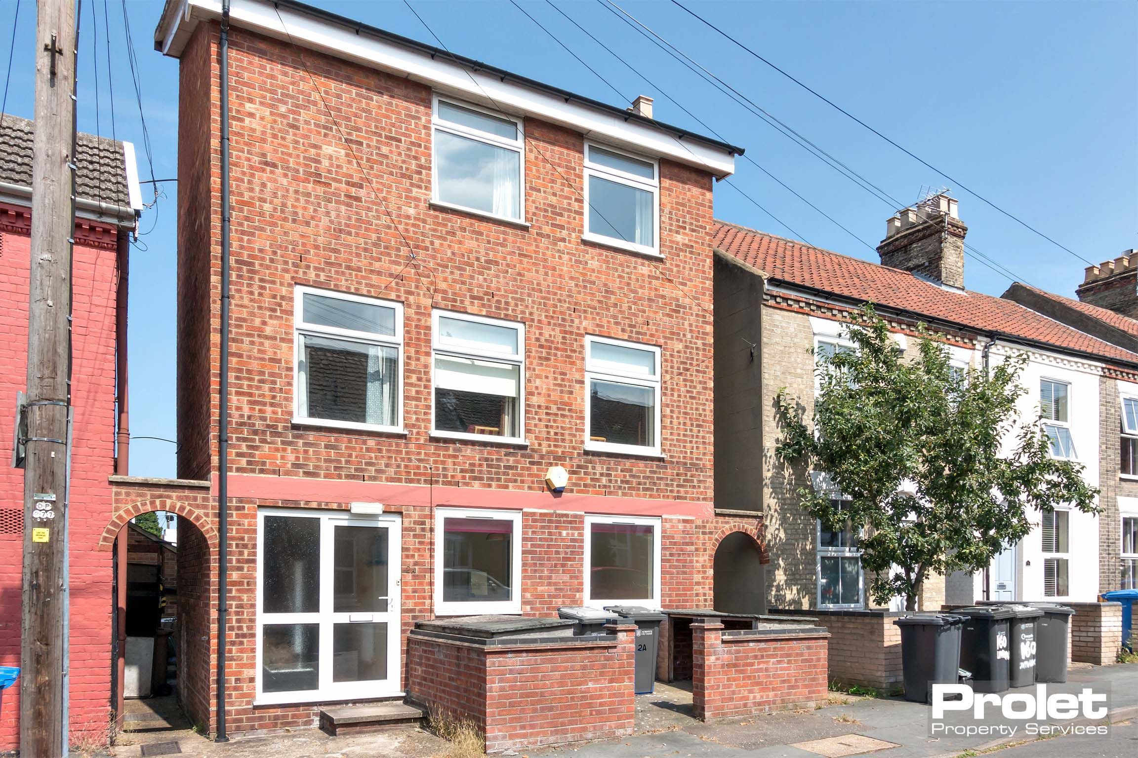 Three storey red brick house