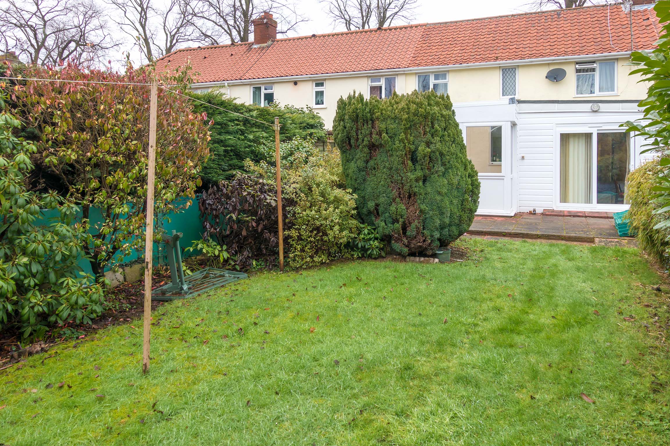 Rear view of property laid to lawn