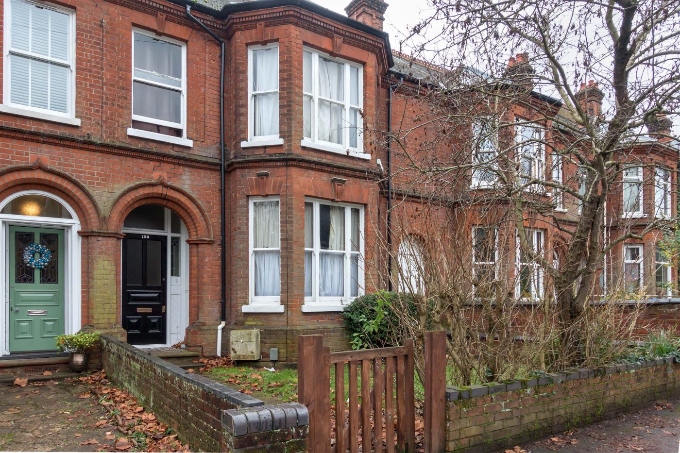 Large terraced house with front garden, and bay windows