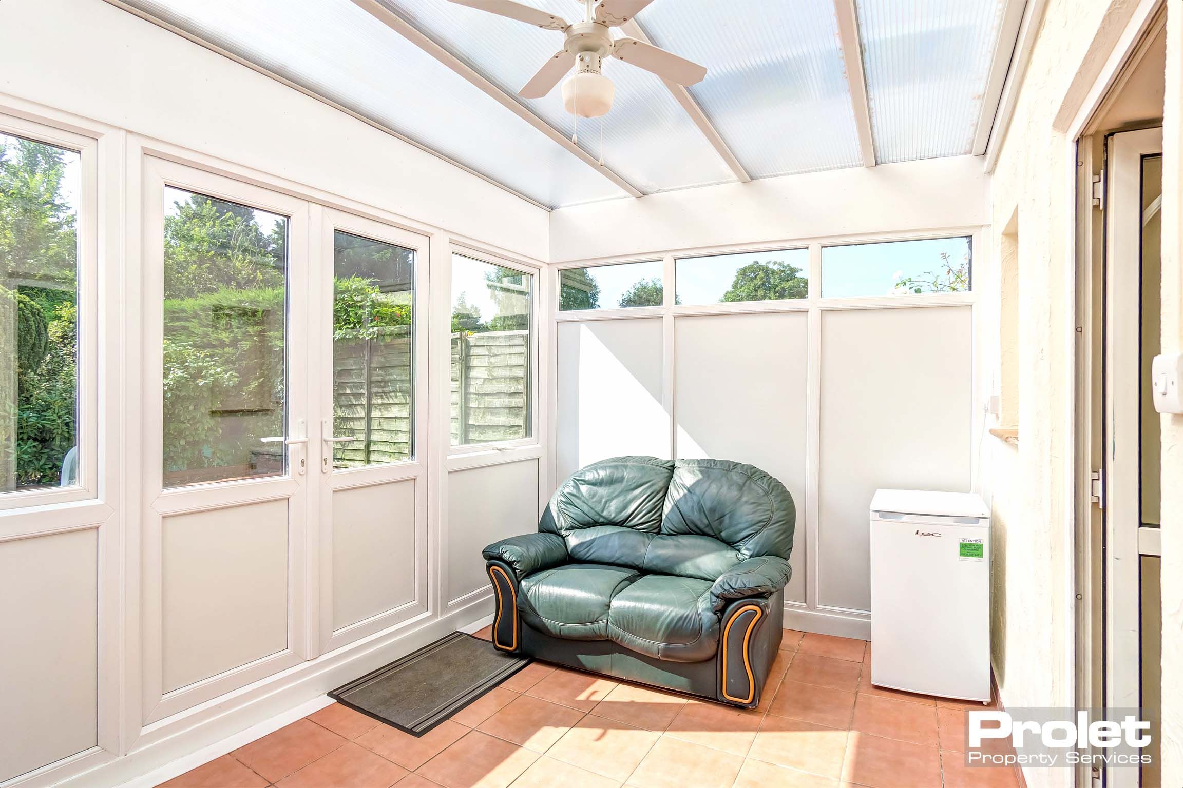 Conservatory with leather sofa