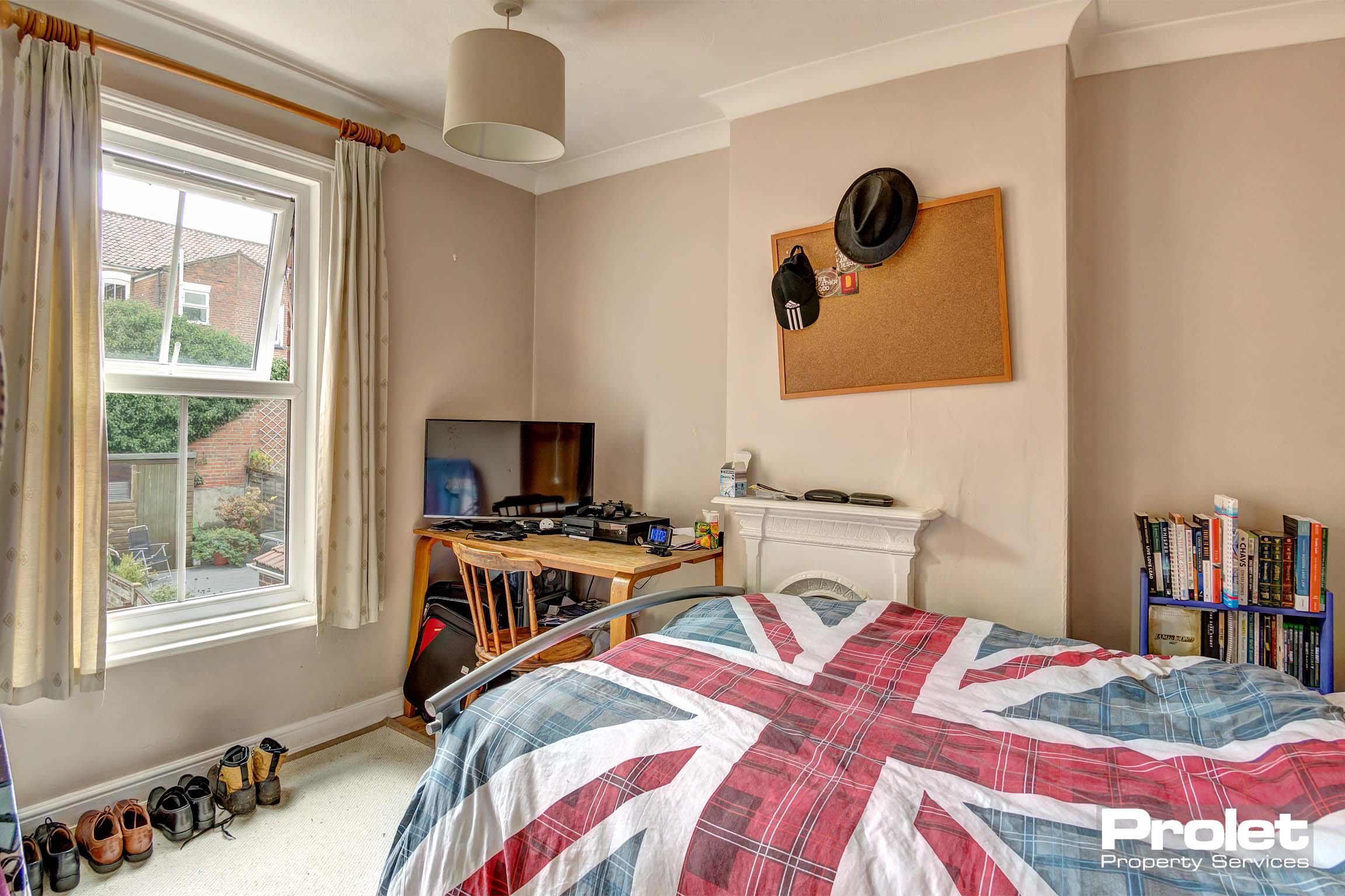 Bedroom with double bed and desk