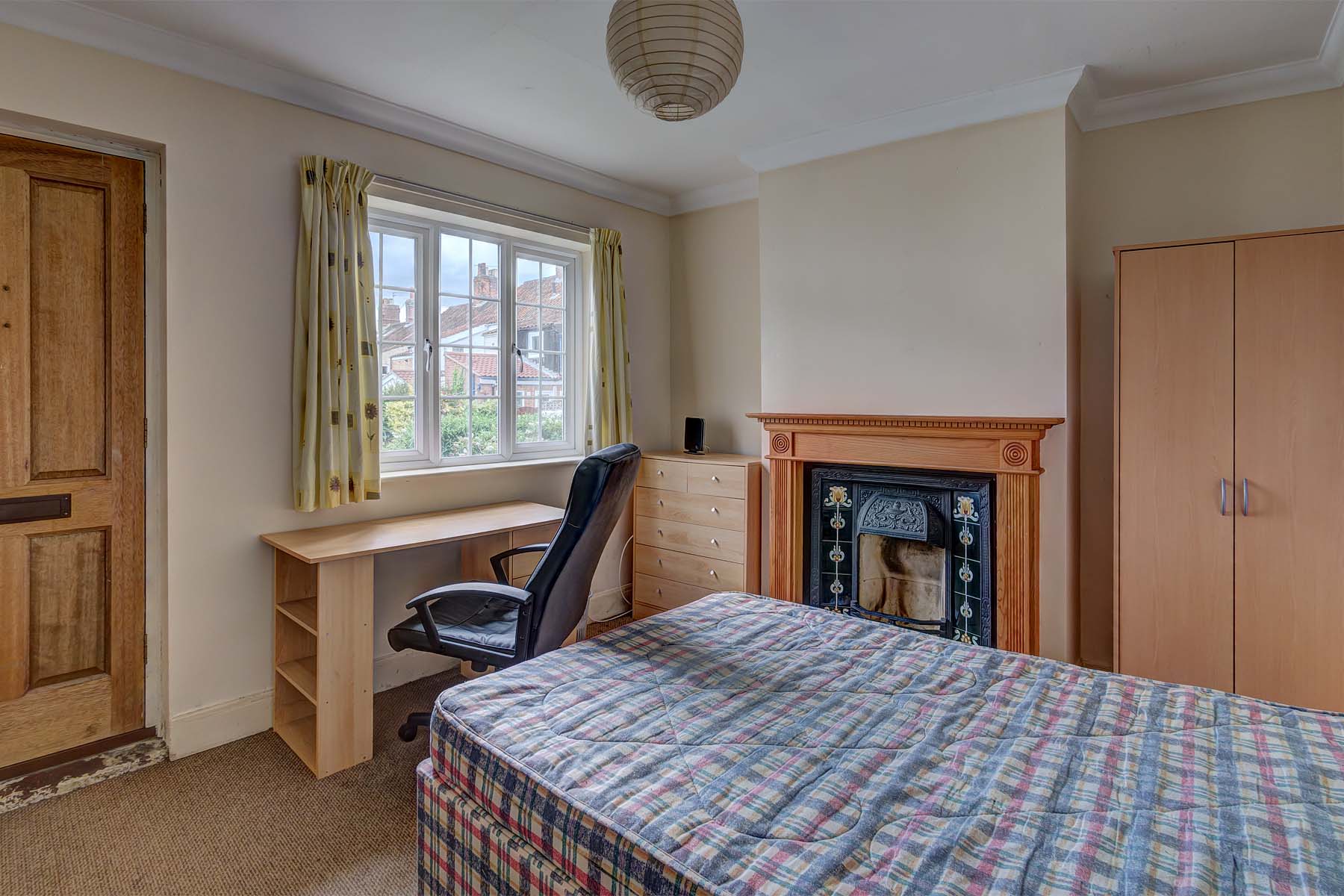 Double bed with desk and period fireplace