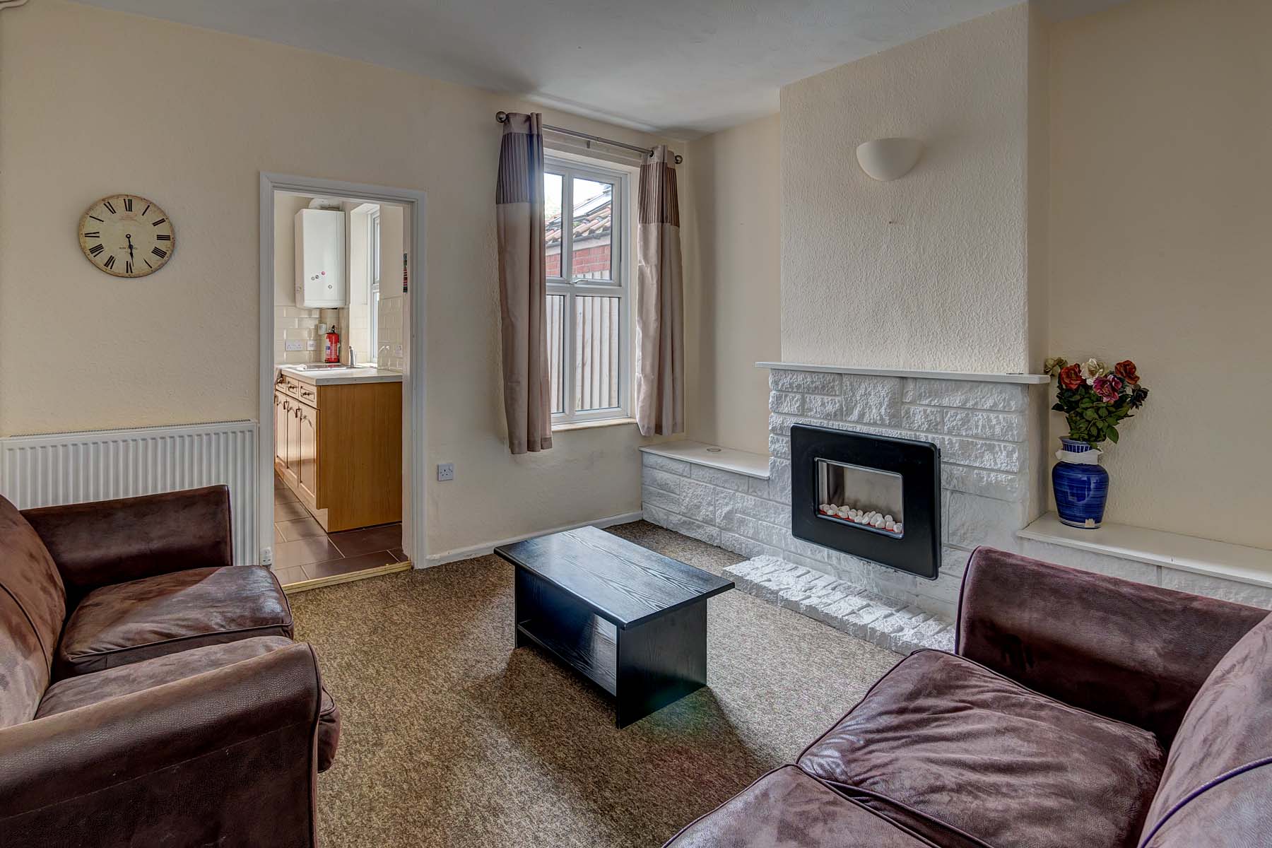 Living room with sofa's and fireplace