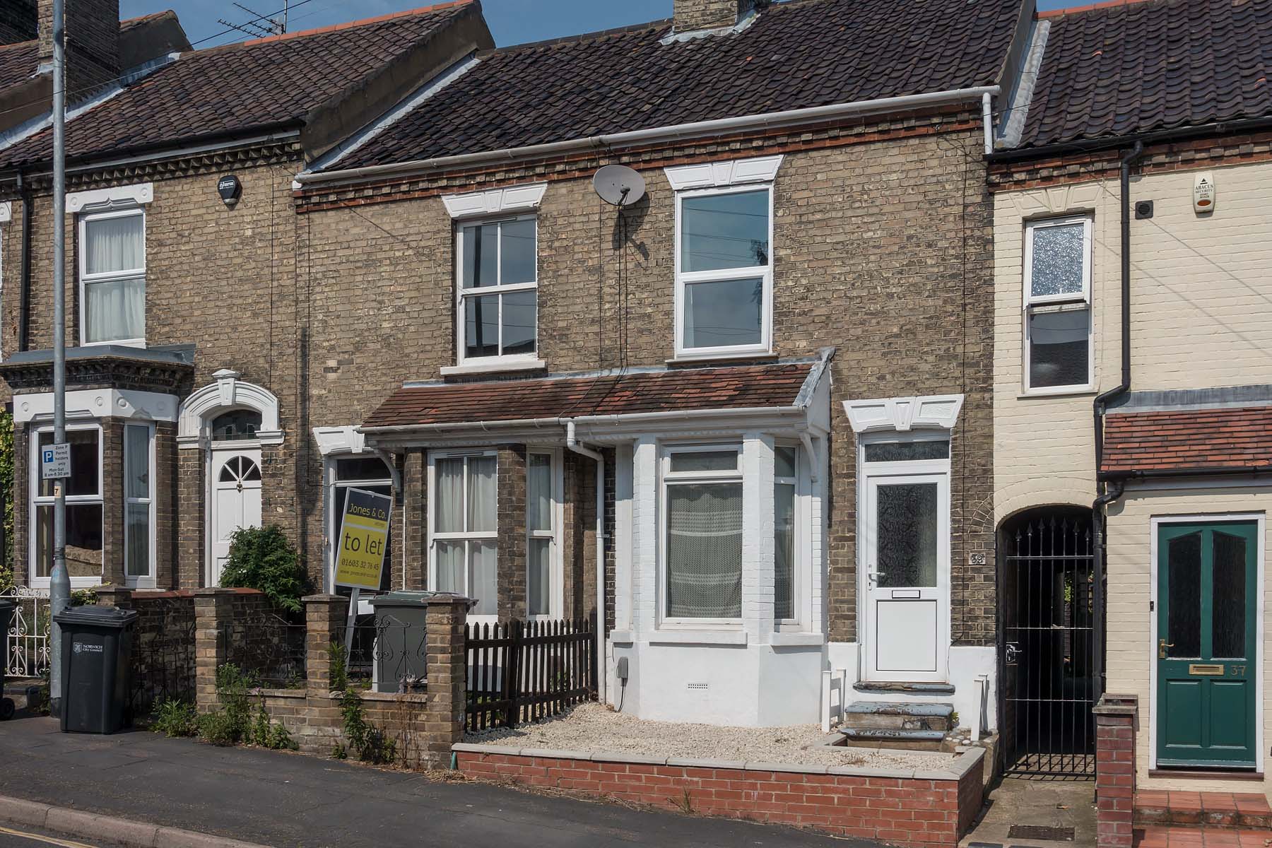 Brick terraced house with bay window