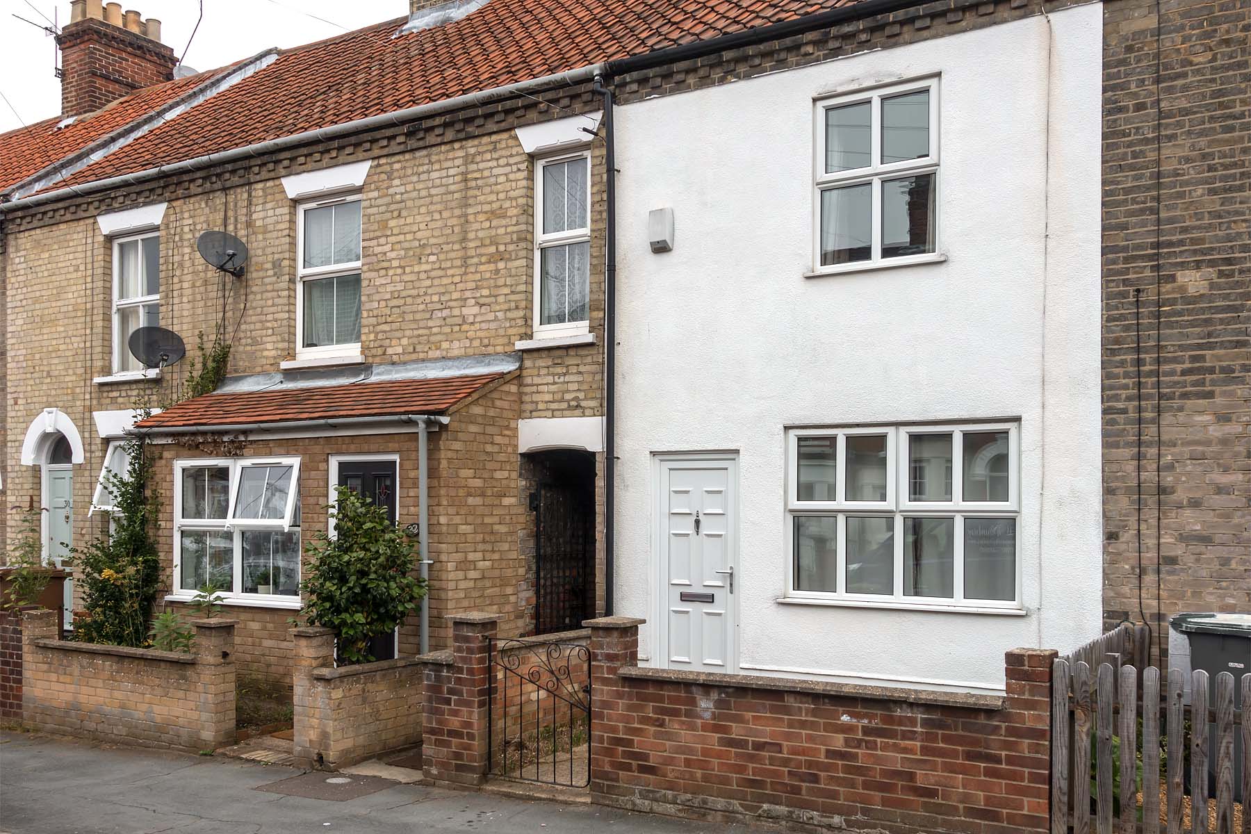 White terraced house with white front door