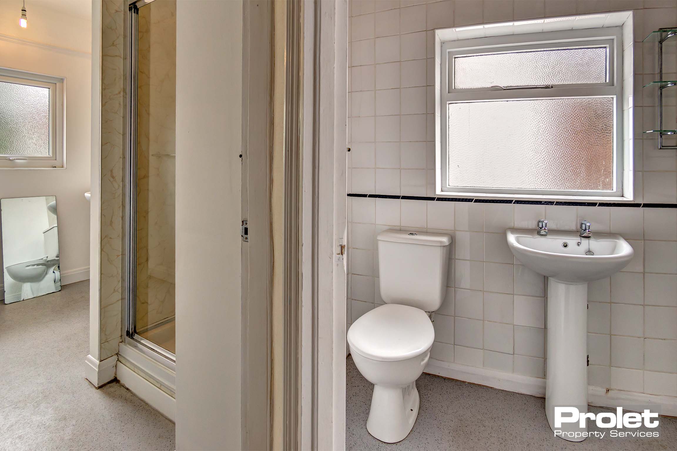 White tiled bathroom with sink and toilet.