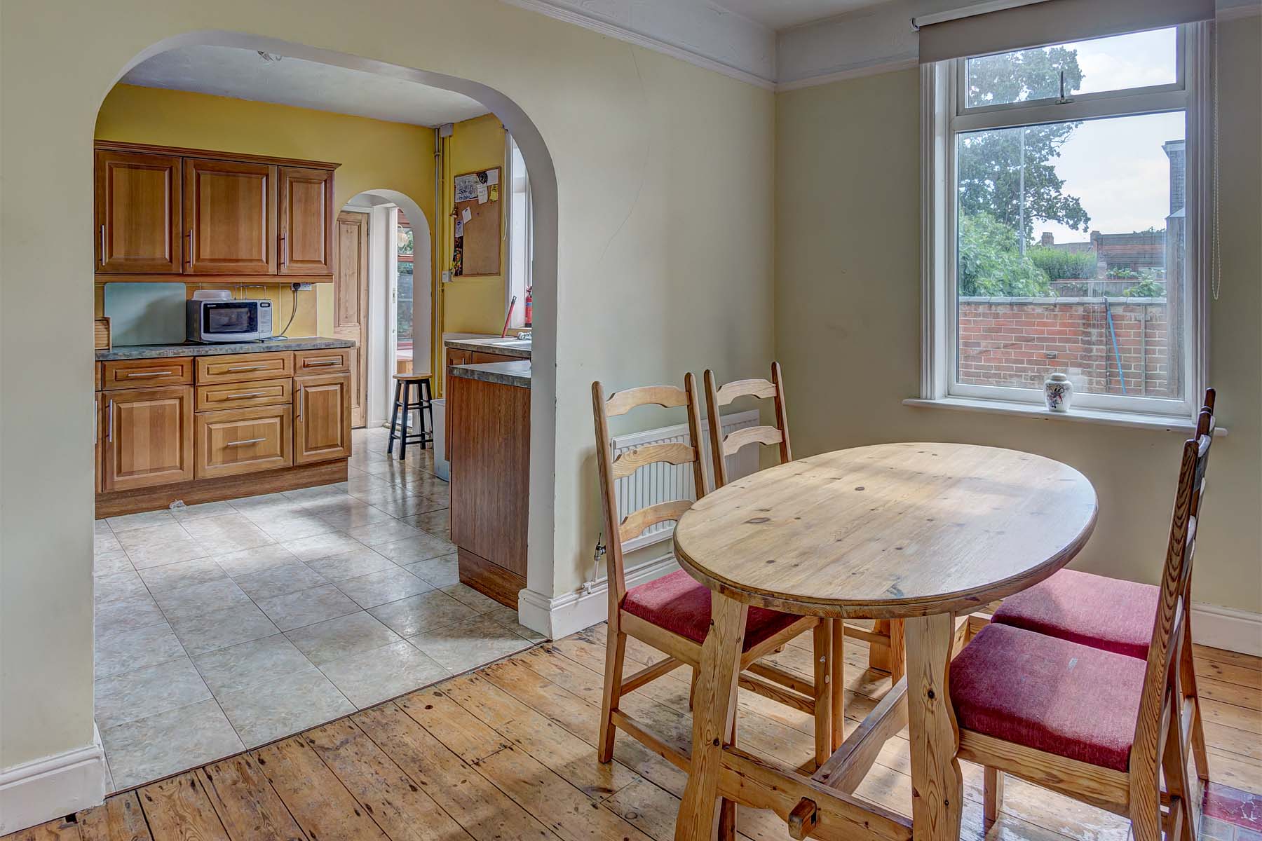 Dining area that leads to the kitchen, dining set included.