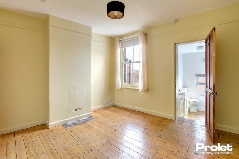 Buttermilk walls with stripped floorboards