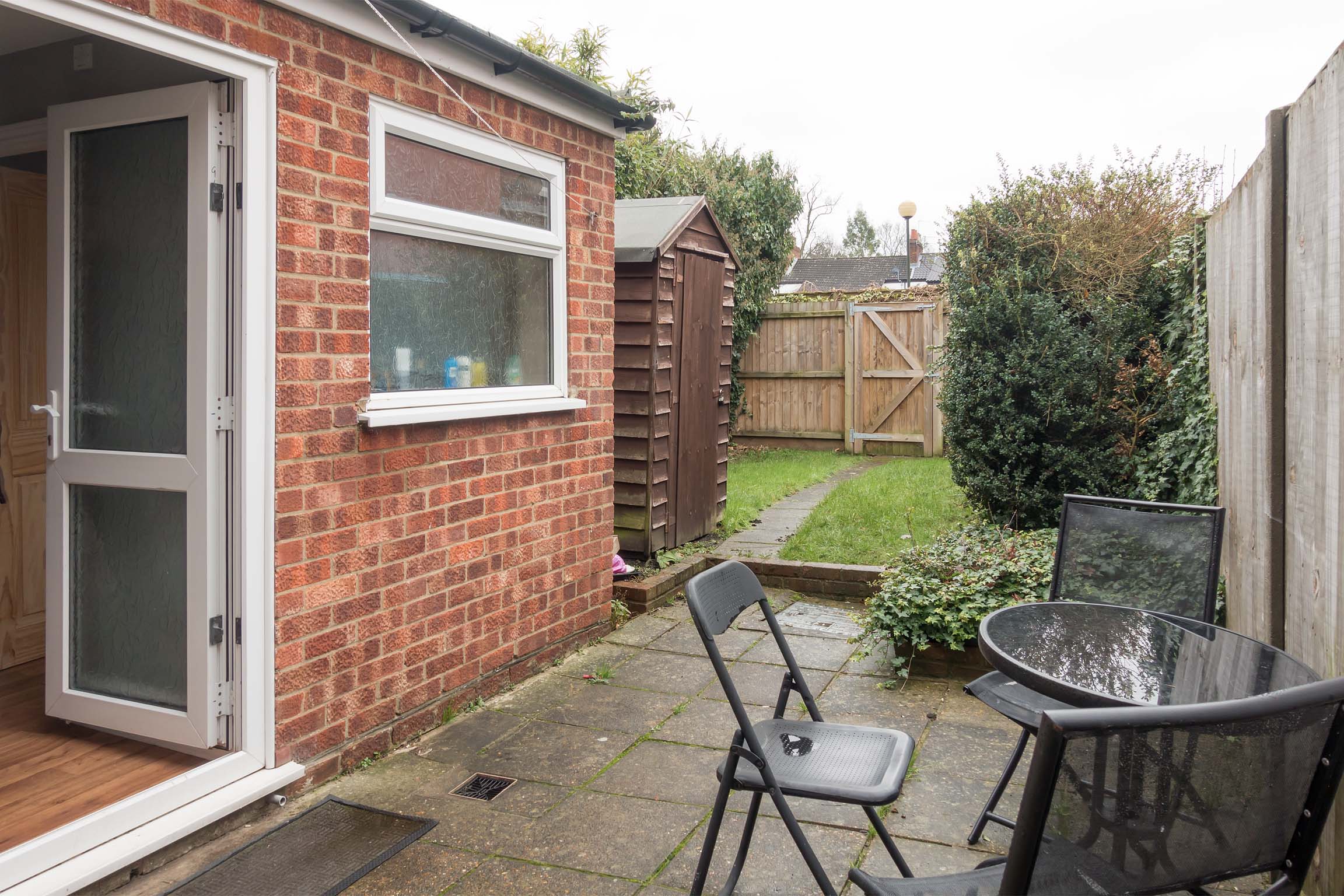 Rear garden with lawn and patio