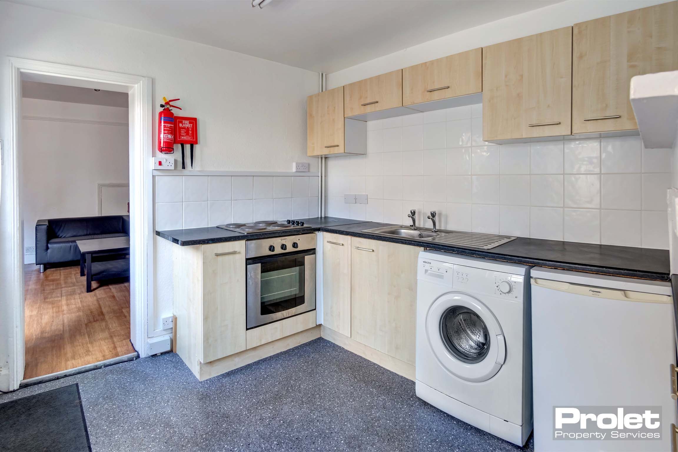 Kitchen with cream fittings and white goods