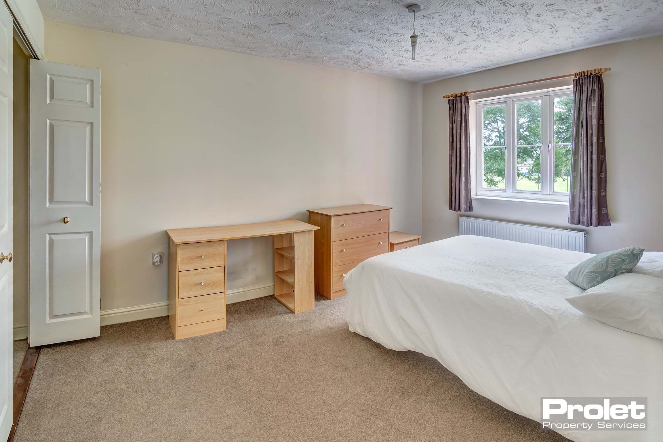 Double bedroom with brown furniture