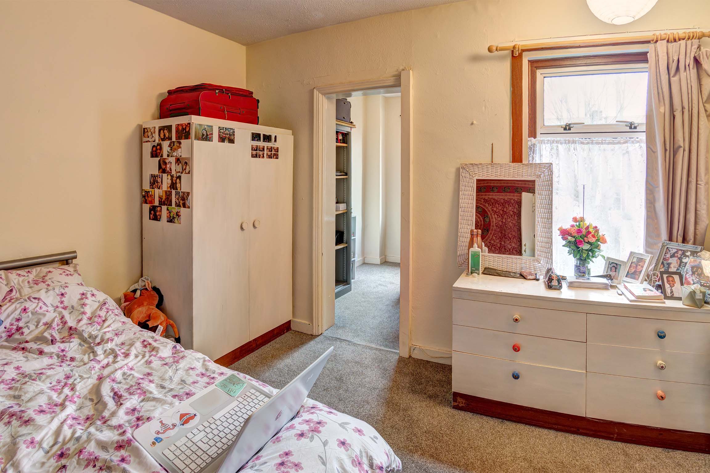 Bedroom with door to study room