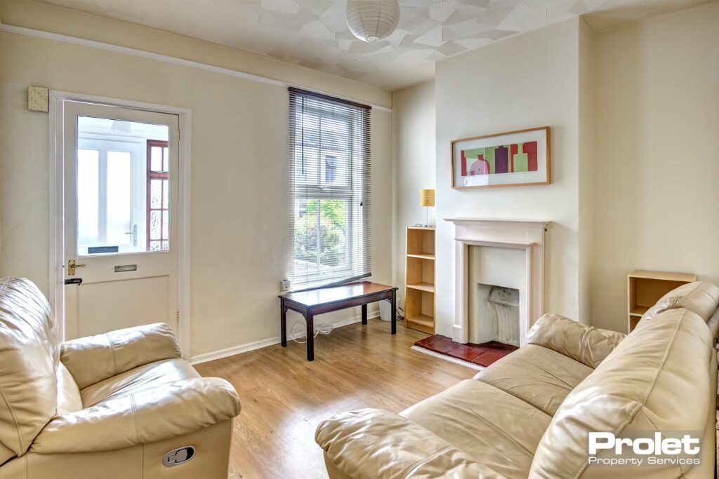 Living room with cream sofas