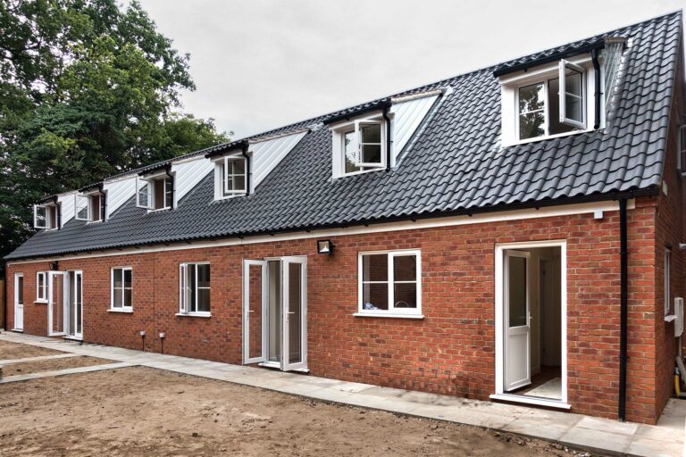 Modern red brick barn style building