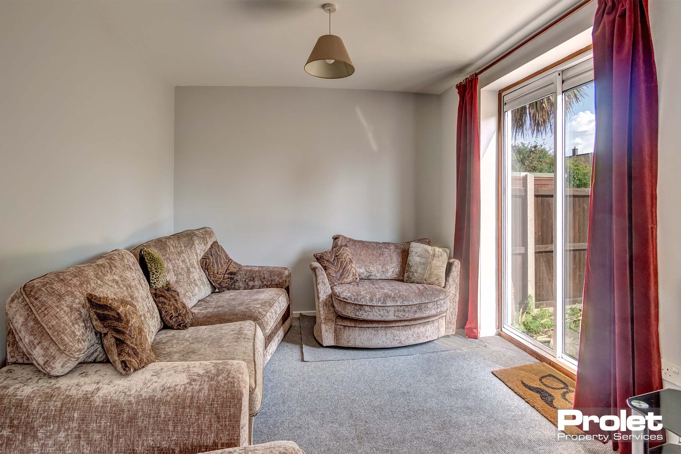 Lounge area with fabric sofas and french doors.