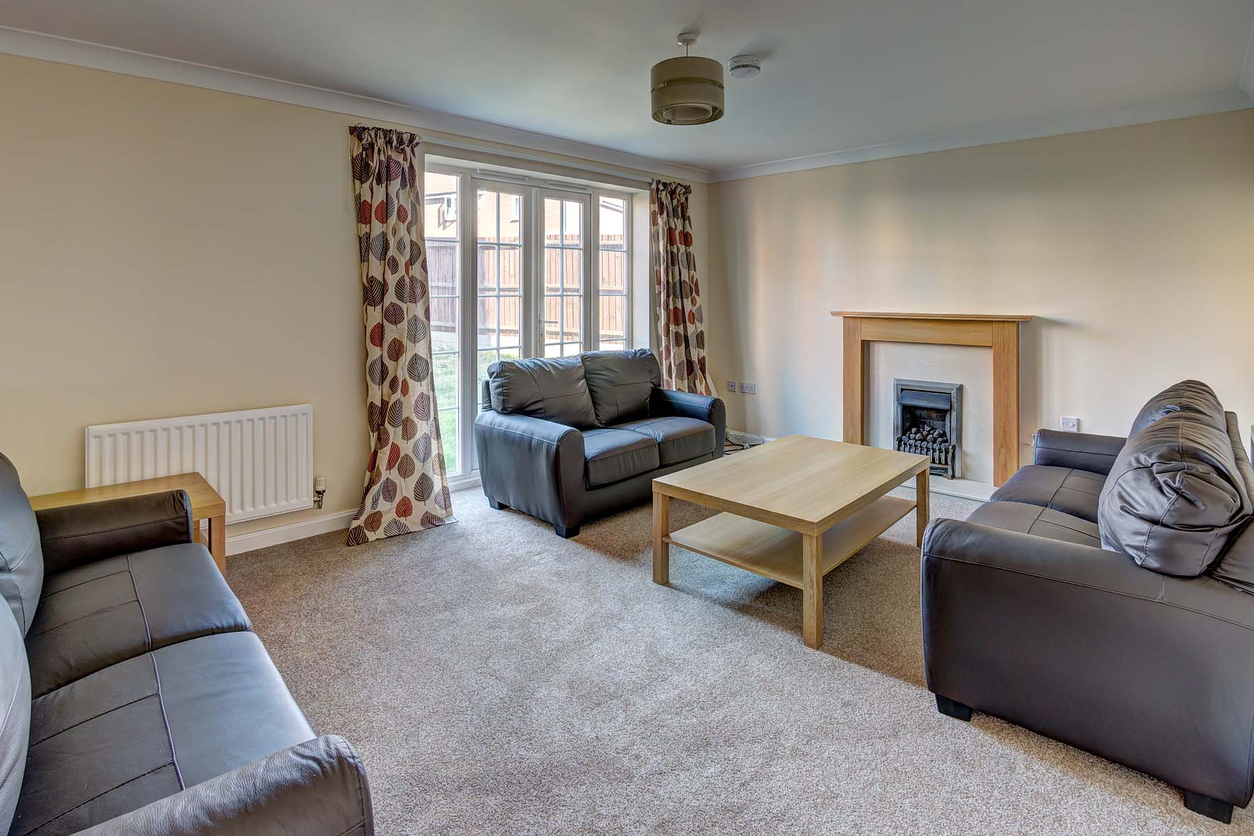 Living room with black sofas