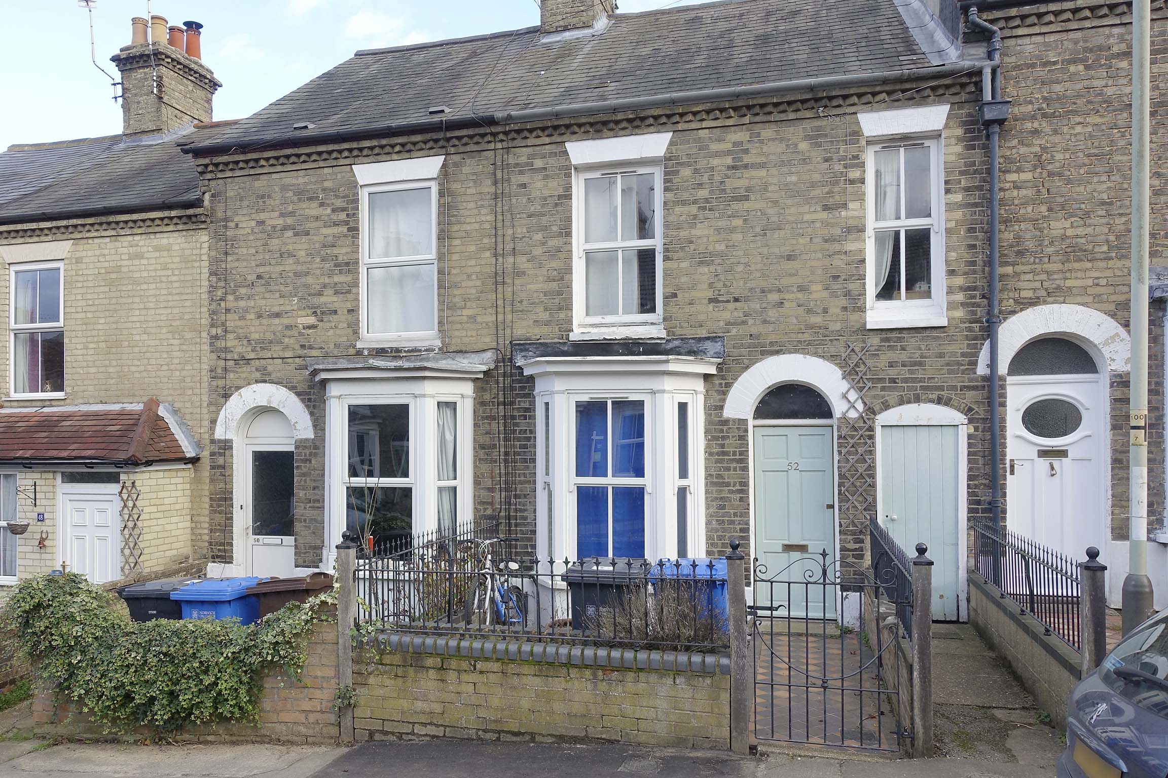 Brick terraced house with blue door