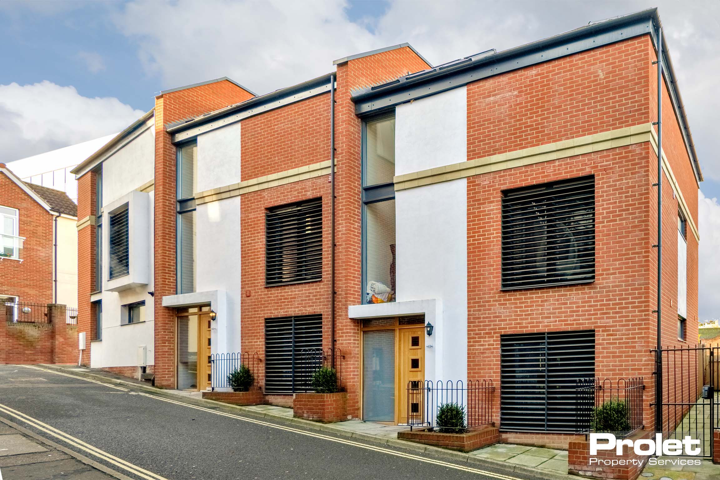 White and orange brick town house