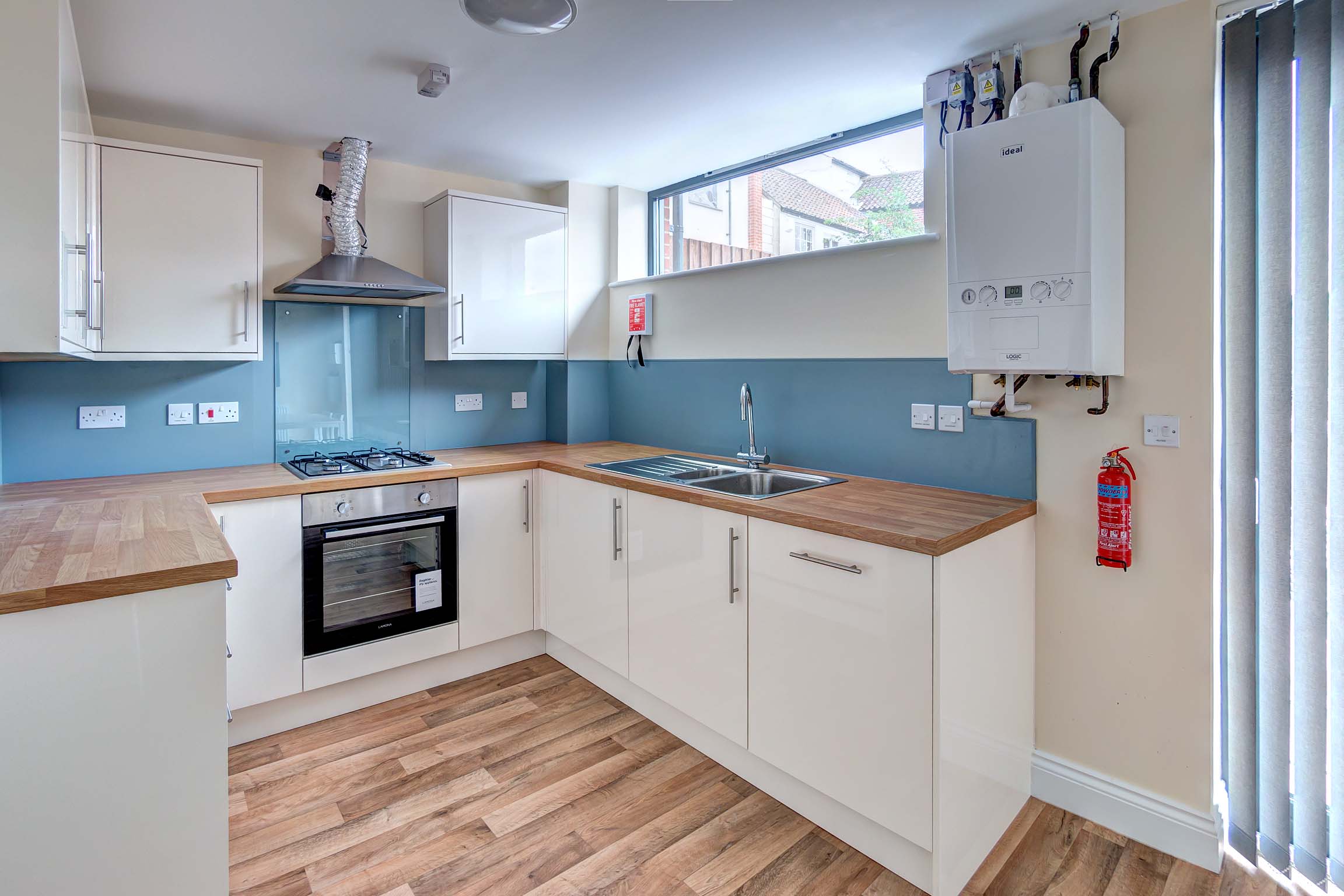 White fitted kitchen with oven