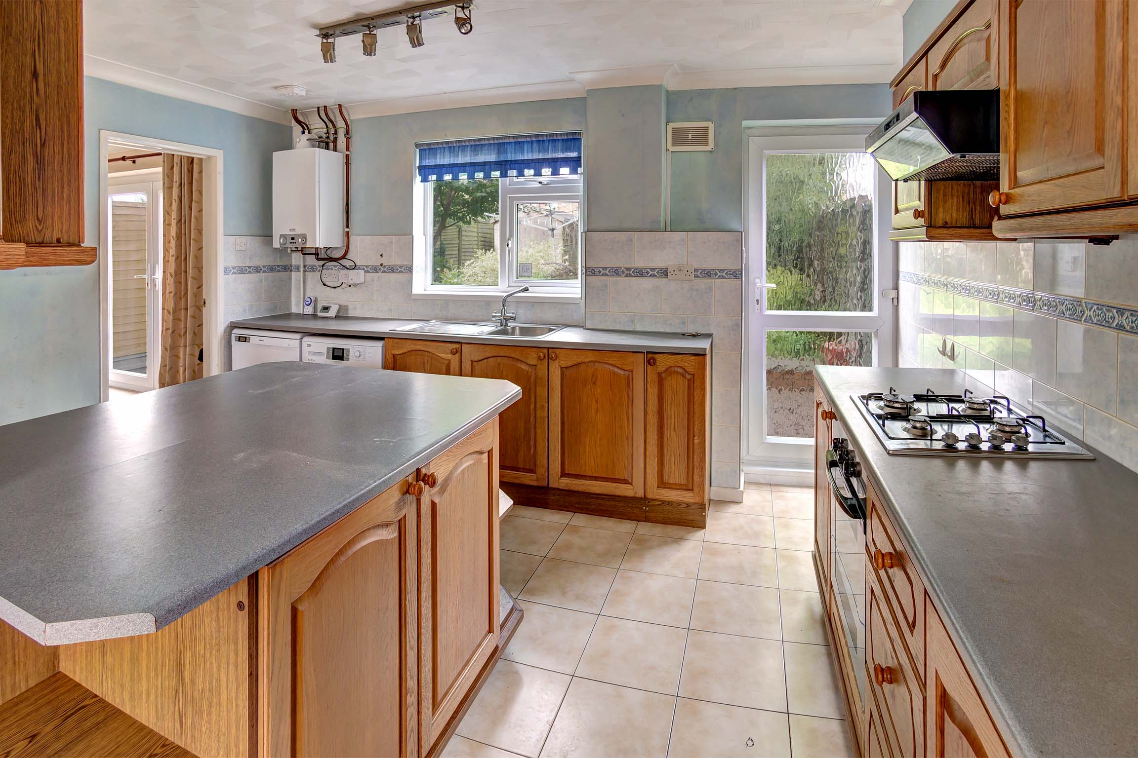 Large kitchen area with island units.