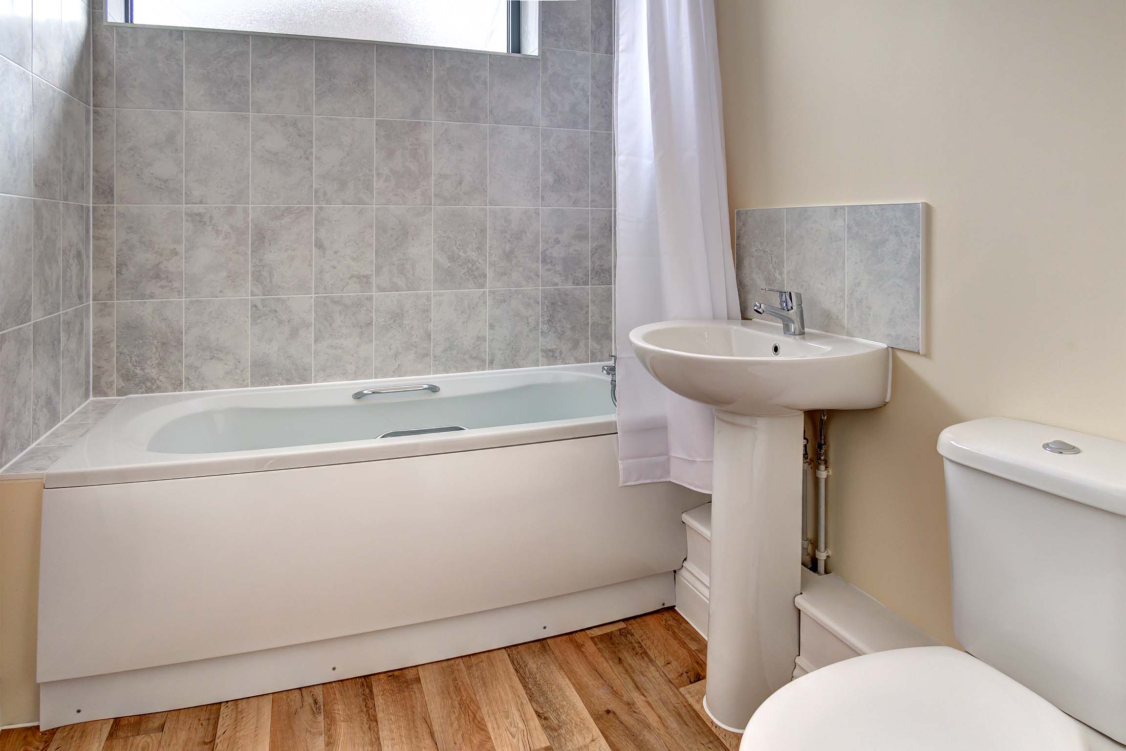 White bath tub and sink