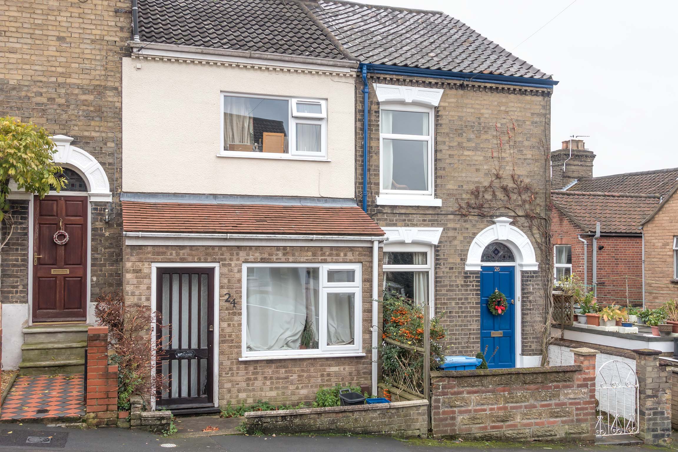 Terraced house with porch and brown front door