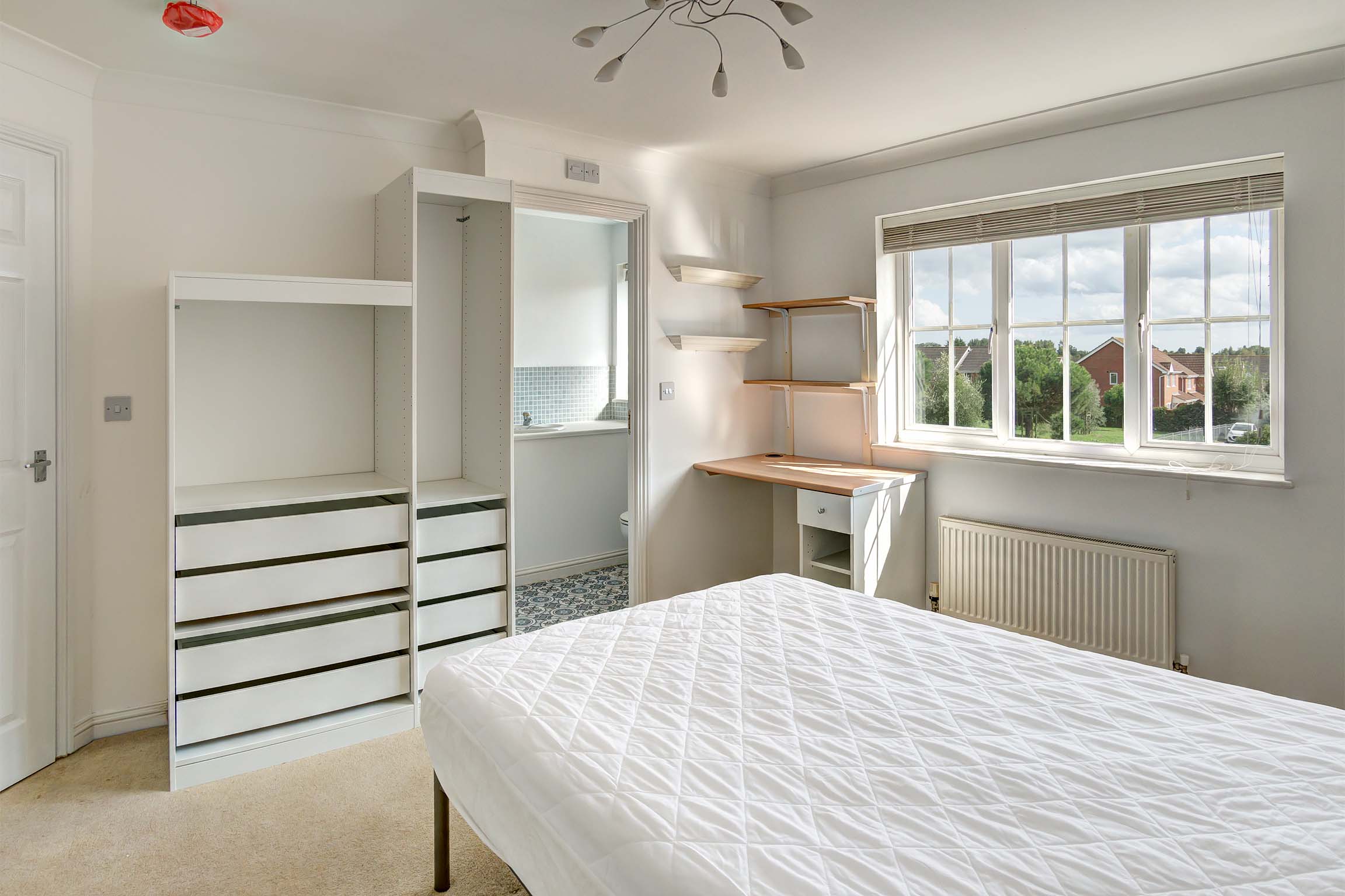 Bedroom with white furnishings