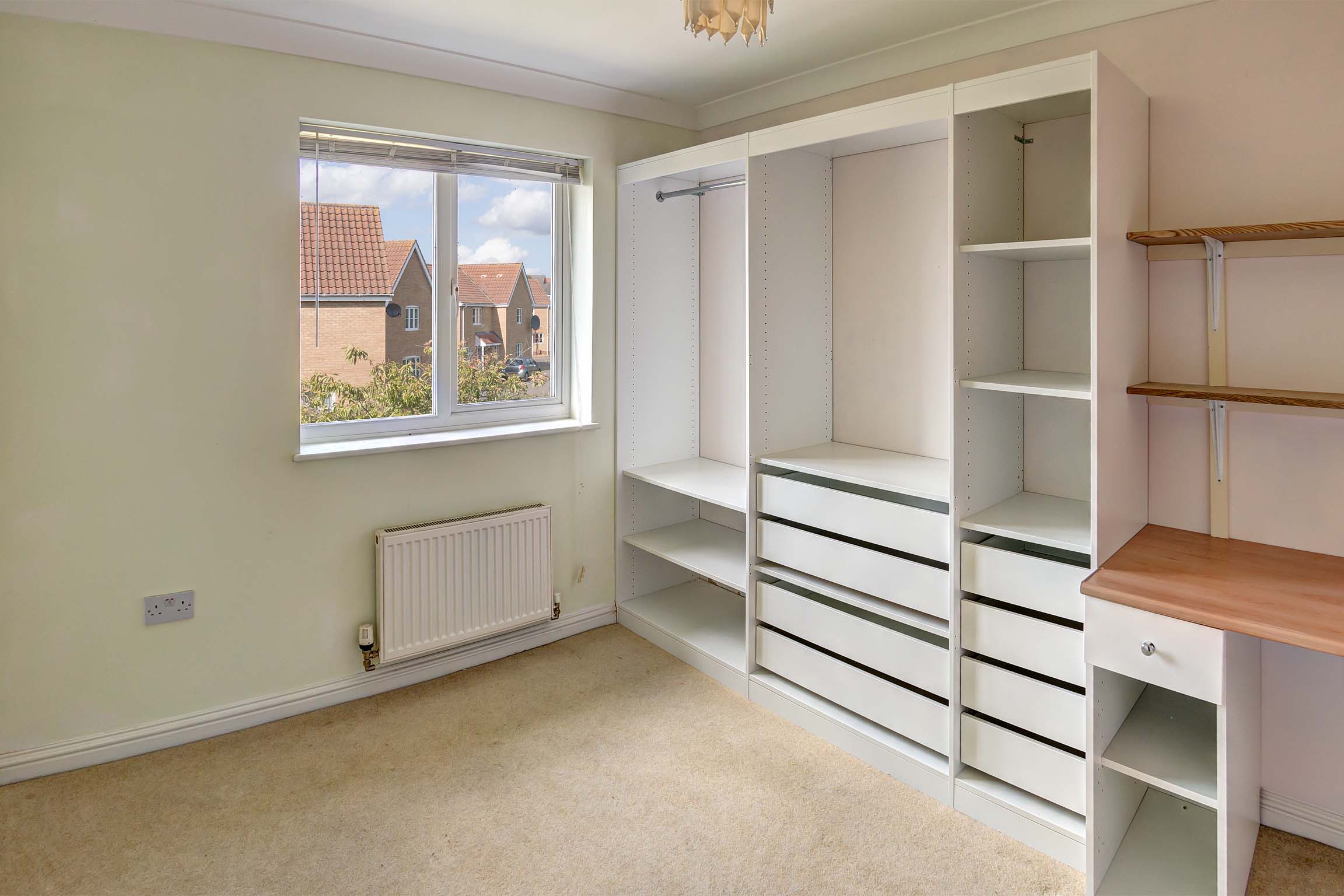 White wooden wardrobe and drawers unit