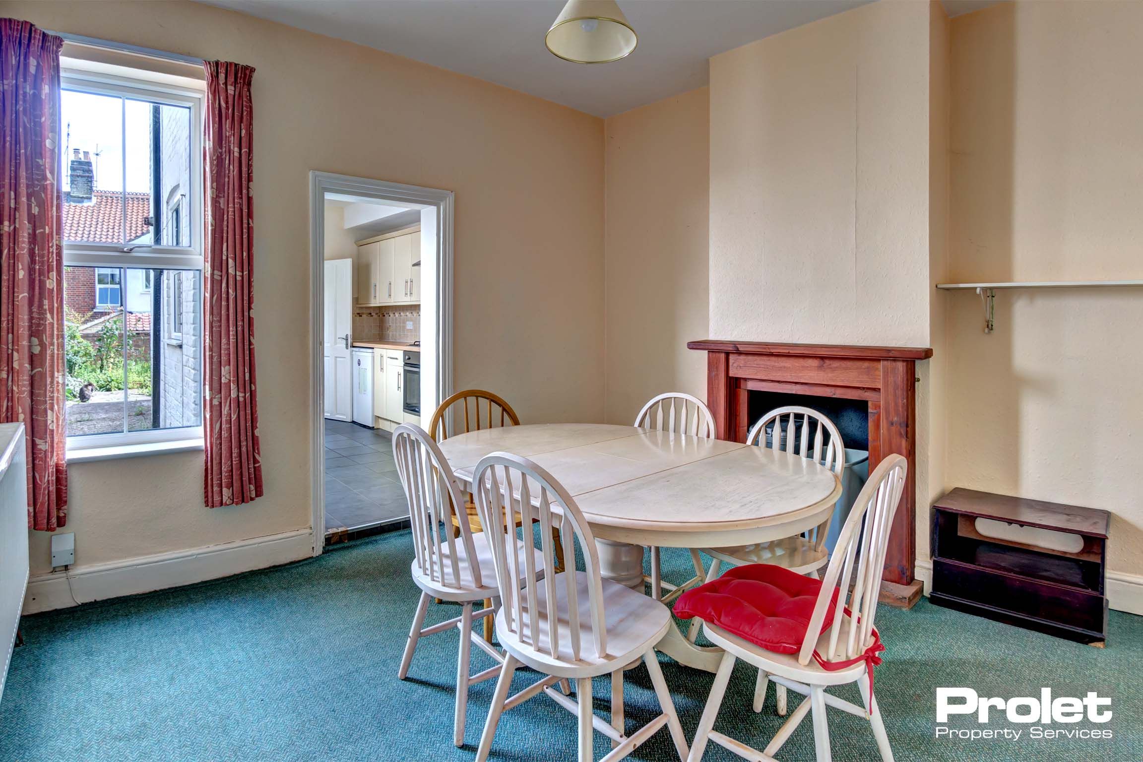 Dining room with dining table set and fireplace