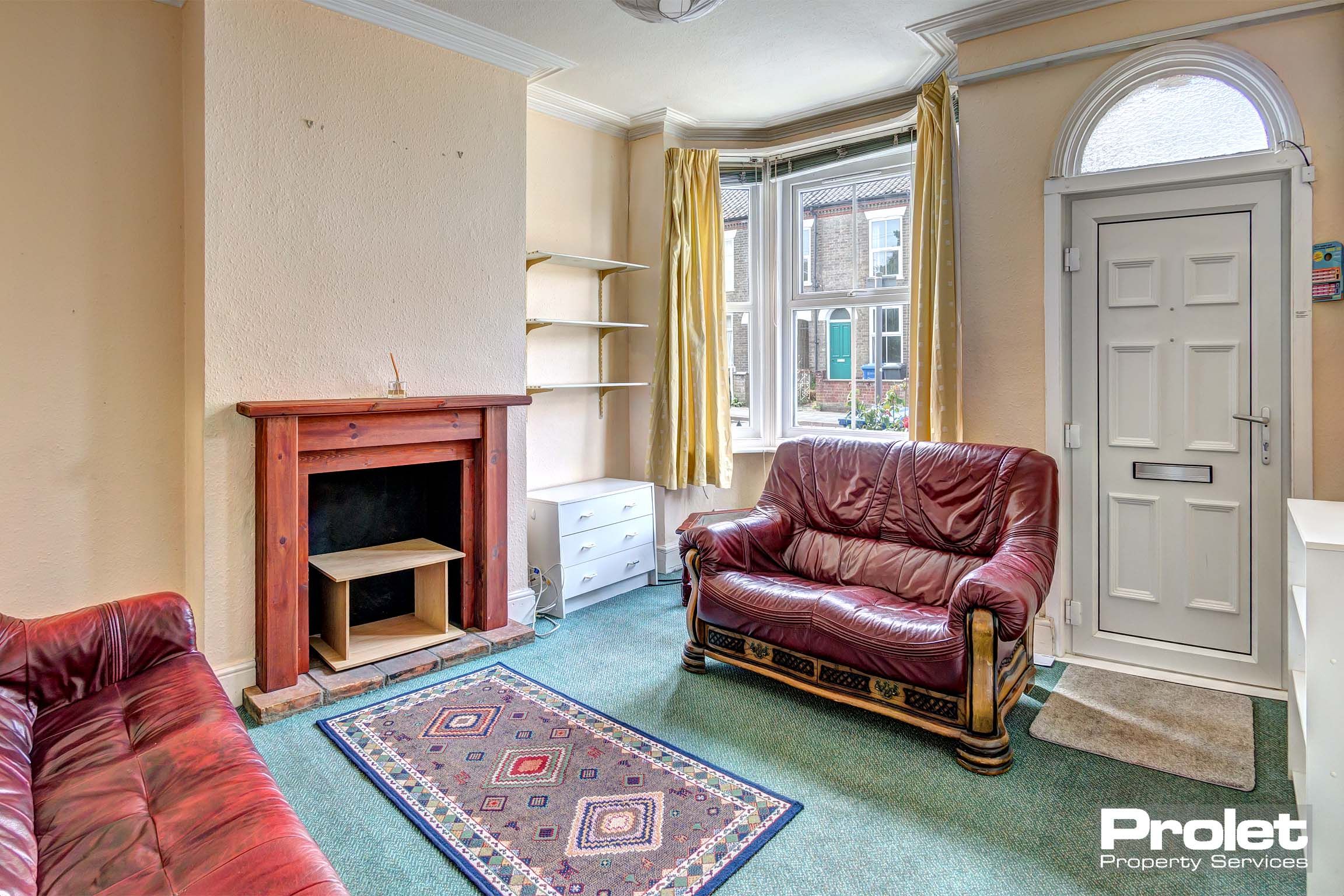 Living room with bay window and sofas