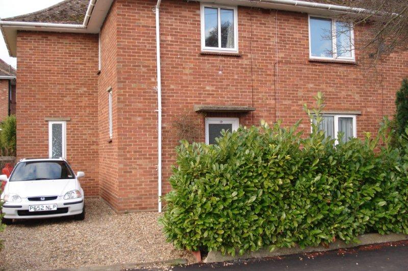 Red brick semi-detached house with large driveway