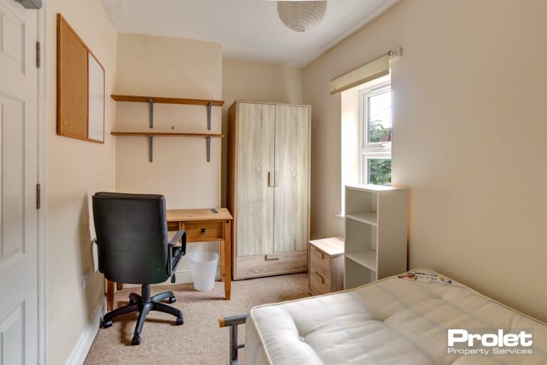 Bedroom with desks and wardrobe