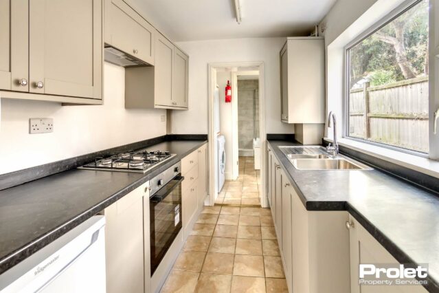 New fitted taupe coloured kitchen with black worktops. New gas hon and electric oven. Under counter fridge. Rear lobby with under counter freezer ontop of washing machine