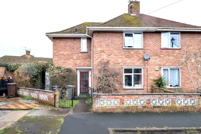 Semi-Detached red brick house with tidy front garden